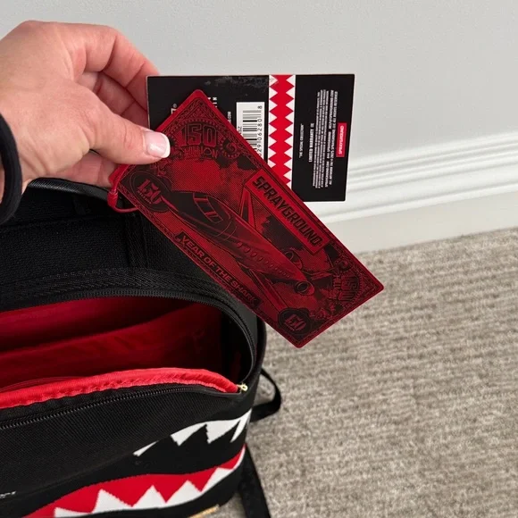 Sprayground Black Backpack with Vibrant Red Interior - Picture 3 of 6